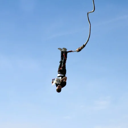 a man bungee jumping in the air