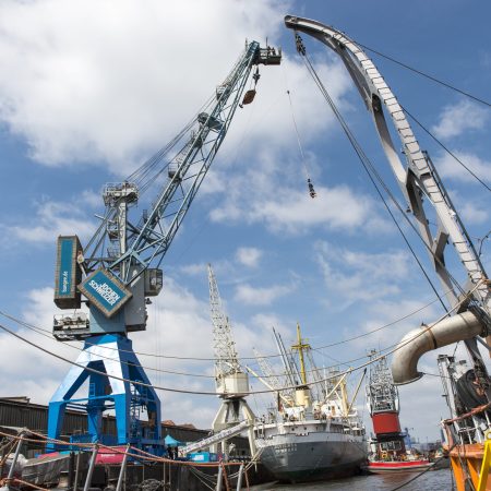a large crane lifting a ship
